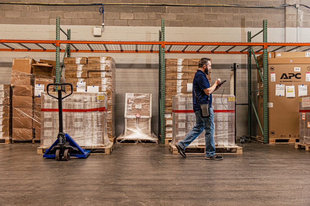 Man holding tablet in warehouse