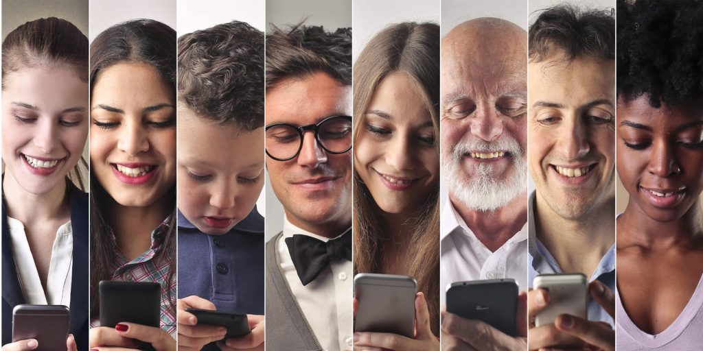 Group of people looking at their phones