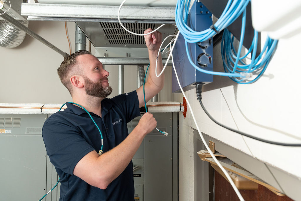 Engineer installing a new VoIP system