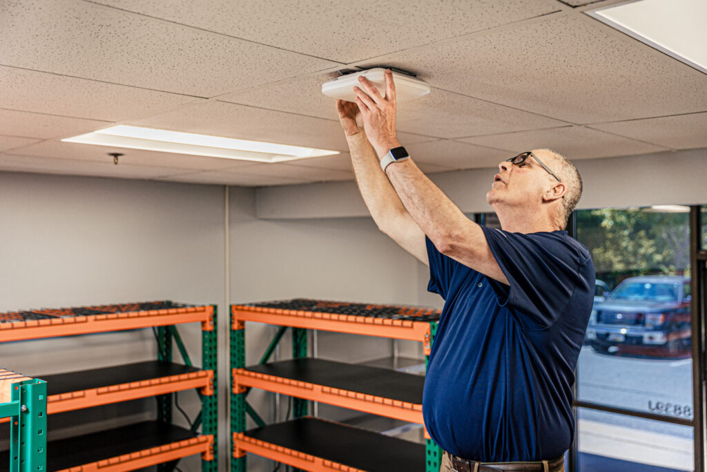 Man installing a Juniper Mist access point
