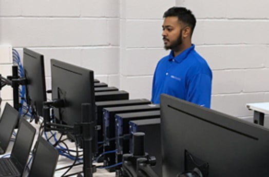 Data Networks employee configuring images for computers