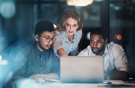 Group of people working on a laptop