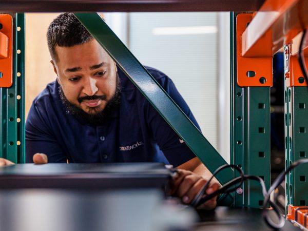 Man plugging in computer